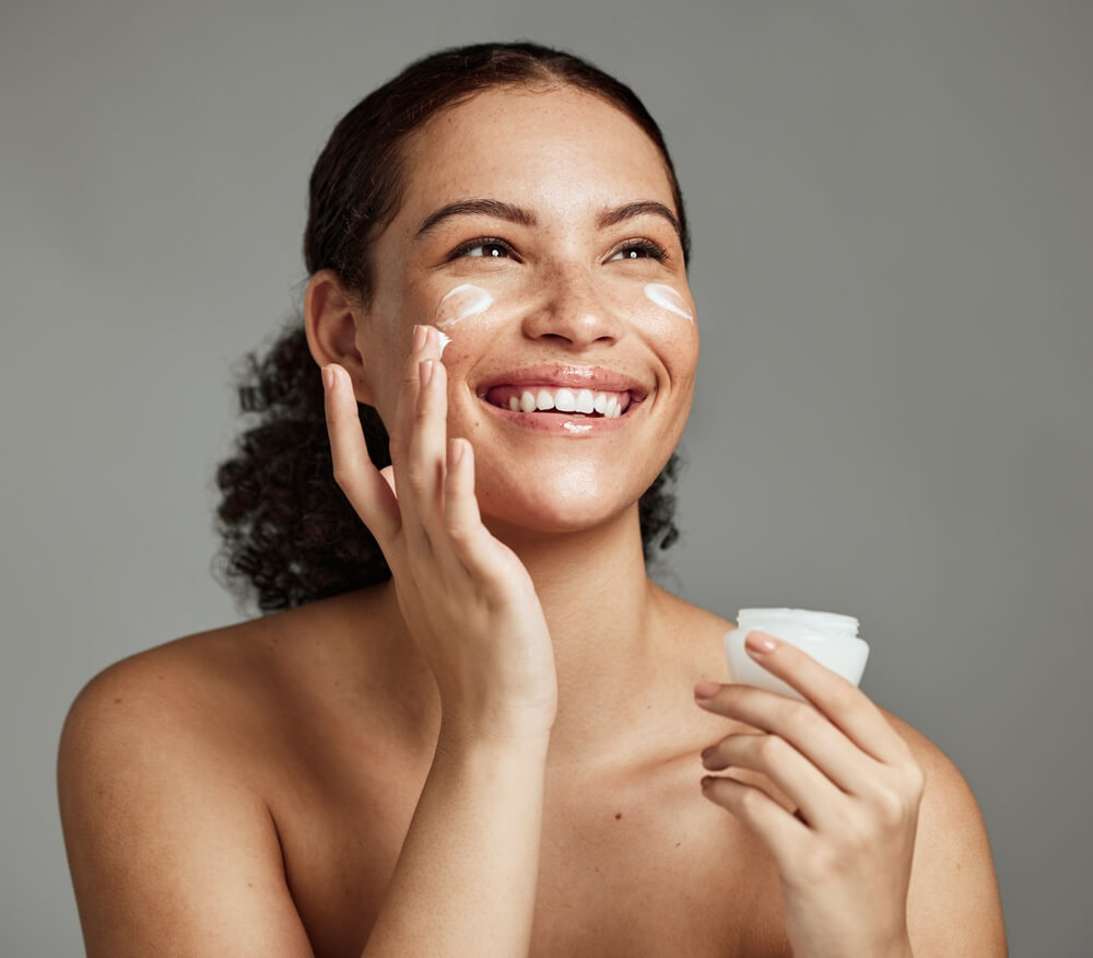 woman applying skincare