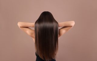 Woman with glossy hair after treatment at home