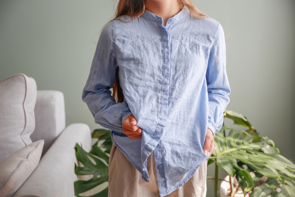 Woman wearing a wrinkled shirt